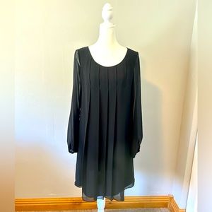 Max Studio black, long-sleeve shift dress with sheer overlay.
